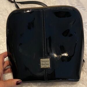 Dooney & Bourke Trixie Crossbody purse - black patent leather with gold trim.